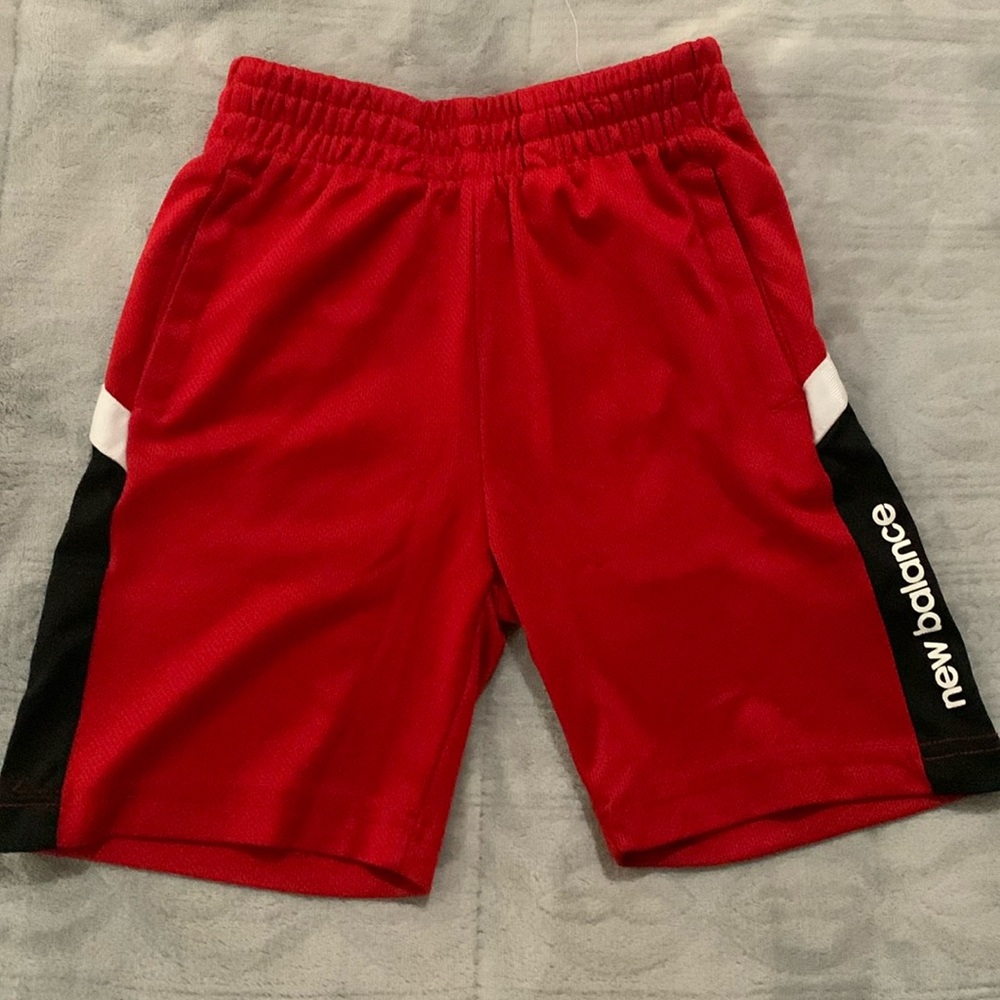 New Balance red and black elastic shorts.